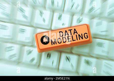 Hand writing sign Data Modeling. Business approach process of transferring data between data storage systems Stock Photo