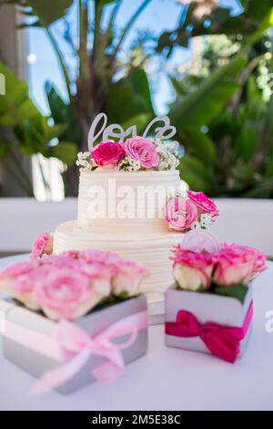 Wedding cake decorated with rose flowers. High quality photo.  Stock Photo