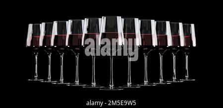 Wine glasses with red wine lined up in a row to form a triangle on black background. Stock Photo
