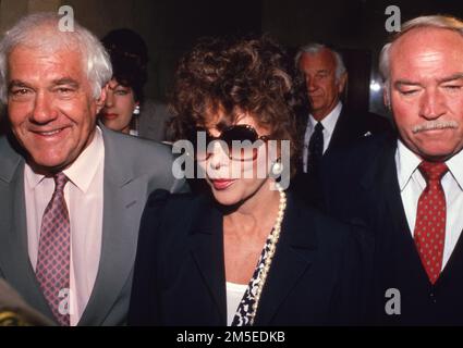 Joan Collins with her lawyer Marvin Mitchelson in court on the day of the verdict against former husband Peter Holm. Holm was limited 20% of Collins' assets based on their initial premarital pact. July 25, 1987 Credit: Ralph Dominguez/MediaPunch Stock Photo