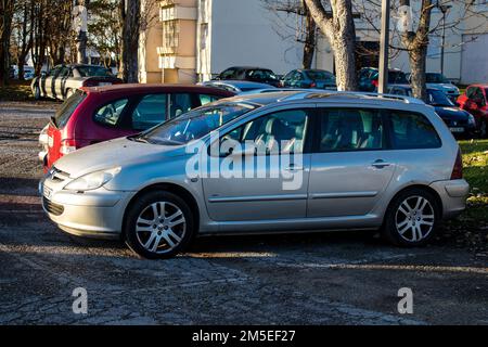 Reims, France - December 27, 2022 Various cars parked in the downtown of Reims, capital of Champagne in France Stock Photo