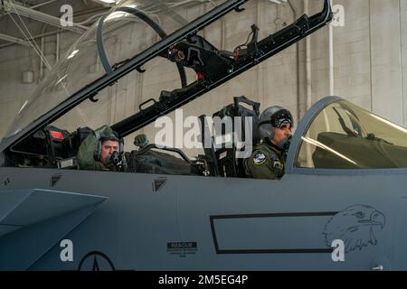 Col. Sean Bittner, 413th Flight Test Group commander, left, prepares for flight in an F-15 with Lt. Col. Matthew Griffin, 339th Flight Test Squadron commander, March 7, 2022, at Robins Air Force Base, Georgia. The flight was Bittner’s final one in a military aircraft, as he is set to retire after 27 years of service. Bittner started his military career March 1995 with Joint Specialized Undergraduate Pilot Training at Reese Air Force Base, Texas. He was first a part of the 413th FTG as an F-22 flight commander with the 514th Flight Test Squadron at Hill AFB, Utah, from September 2007 to March 2 Stock Photo