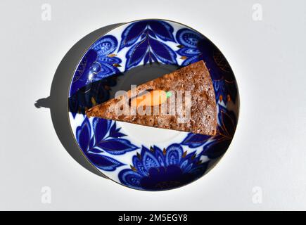 A piece of carrot cake on the coloured plate Stock Photo
