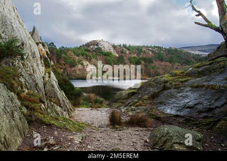 A view looking across Lake Padarn from the rocky crag of Craig yr Undeb (Union Rock) in the Snowdonia National Park. Stock Photo