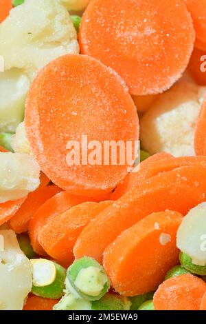 Fresh soup vegetables with carrots, peas, cauliflower and corn on white background. Frozen soup vegetables with carrots, peas, cauliflower and corn. M Stock Photo