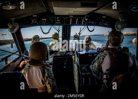 220309-N-NT795-506 SEAL BEACH, Calif. (March 9, 2022) Sailors assigned to Maritime Expeditionary Security Squadron (MSRON) 11 operate a 34-foot Sea Ark patrol boat during boat crewman and engineering training as part of Maritime Expeditionary Security Force (MESF) Boat University Basic-Course. MESF is a core Navy capability that provides port and harbor security, high value asset security, and maritime security in the coastal and inland waterways. Stock Photo