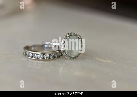 Close up photo of a diamond wedding band and engagement ring set in white gold Stock Photo