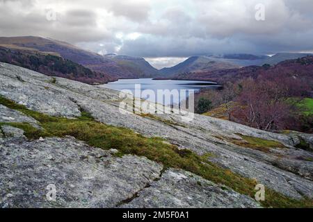 A view looking across Lake Padarn towards the Llanberis Pass from the rocky crag of Craig yr Undeb (Union Rock) in the Snowdonia National Park. Stock Photo