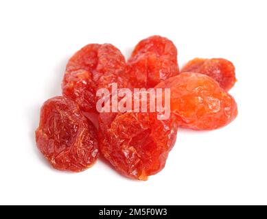 Cornus mas, cornel or Cornelian cherry, European cornel or Cornelian cherry dogwood. Dried fruit isolated on white background. Stock Photo