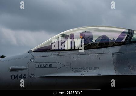 A U.S. Air Force pilot assigned to the 510th Fighter Squadron taxis an F-16 Fighting Falcon prior to takeoff at Royal Air Force Lakenheath, England, March 9, 2022. The 510th Fighter Squadron is based out of Aviano Air Base, Italy, but is temporarily operating out of RAF Lakenheath to conduct regularly scheduled training. Stock Photo