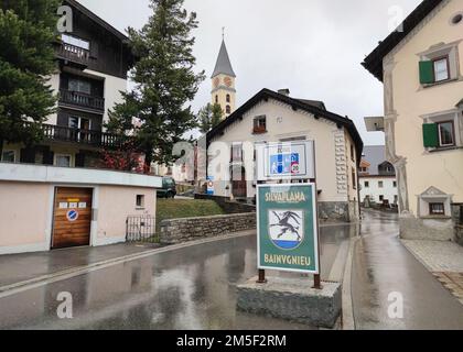 Entrance sign and townscape of Silvaplana in Engadin Valley, Switzerland on a rainy day Stock Photo