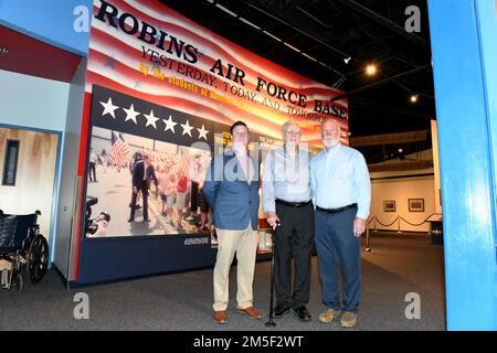 Ryan Arflin, left, Warner Robins Air Logistics Complex Training Data Analysis and Training Modernization specialist, his grandfather G. L. Arflin, center, and father, Steve Arflin, both Robins Air Force Base retirees, visit the Museum of Aviation at Robins Air Force Base, Georgia, March 10, 2022. Four generations of the Arflin family have supported the Air Force sustainment mission at Robins for almost 80 years. Stock Photo