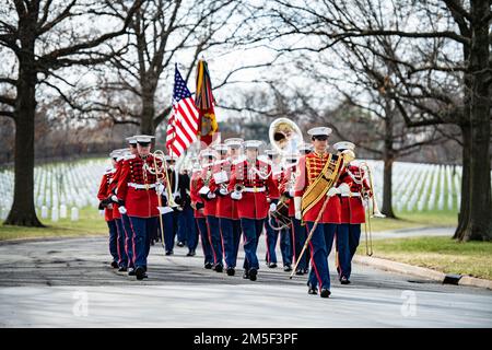 Marines from the “The President’s Own” Marine Band conduct military funeral honors with funeral escort for U.S. Marine Corps Cpl. Thomas Cooper in Section 57 of Arlington National Cemetery, Arlington, Va., March 10, 2022. Cooper was killed during World War II at age 22.    From the Defense POW/MIA Accounting Agency (DPAA) press release:    In November 1943, Cooper was a member of Company A, 2nd Amphibious Tractor Battalion, 2nd Marine Division, Fleet Marine Force, which landed against stiff Japanese resistance on the small island of Betio in the Tarawa Atoll of the Gilbert Islands, in an attem Stock Photo
