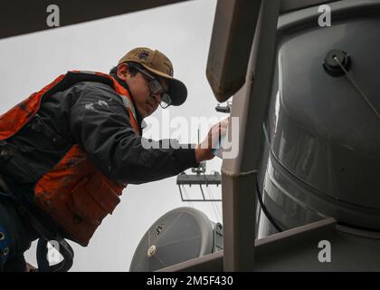 NORFOLK, Va. (Mar. 10, 2022) – Seaman Julian Lopez performs maintenance on an abandon ship signal kit aboard the Arleigh Burke-class guided-missile destroyer USS Porter (DDG 78), Mar. 10, 2022. Porter, forward-deployed to Rota, Spain, is currently underway in the U.S. 2nd Fleet area of operations to conduct routine certifications and training. Stock Photo