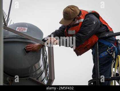 NORFOLK, Va. (Mar. 10, 2022) – Seaman Julian Lopez performs maintenance on an abandon ship signal kit aboard the Arleigh Burke-class guided-missile destroyer USS Porter (DDG 78), Mar. 10, 2022. Porter, forward-deployed to Rota, Spain, is currently underway in the U.S. 2nd Fleet area of operations to conduct routine certifications and training. Stock Photo