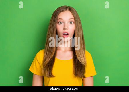 Photo of shocked person open mouth staring cant believe isolated on green color background Stock Photo