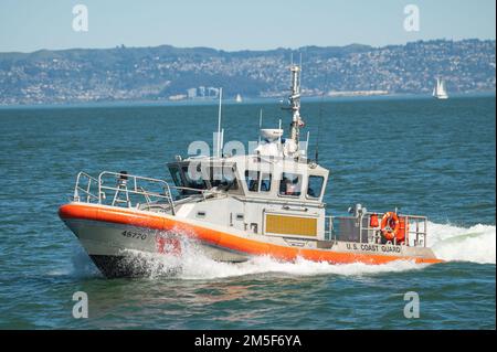 U.S. Coast Guard Station San Francisco crewmembers, aboard a 45-foot response boat medium (RB-M) cruises out to the Golden Gate Bridge to participate in a photo shoot near San Francsico, March 10, 2022. The Coast Guard Cutter Sockeye, assets from Air Station San Francisco and Station Golden Gate all participated in a photo shoot outside the Golden Gate Bridge. Stock Photo