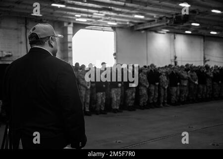 NORFOLK, Va. (Mar. 10, 2022) — Secretary of the Navy Carlos Del Toro prepares to speak to the crew of the Ford-class aircraft carrier USS Gerald R. Ford (CVN 78) during a ship visit March 10, 2022. Secretary Del Toro is in Norfolk for the 100th celebration of Navy aircraft carriers and to conduct a roundtable with senior female leadership during Women’s History Month. Stock Photo