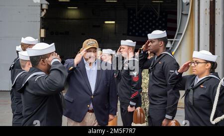 NORFOLK, Va. (Mar. 10, 2022) — Secretary of the Navy Carlos Del Toro renders honors as he departs the Ford-class aircraft carrier USS Gerald R. Ford (CVN 78) following a ship visit March 10, 2022. Secretary Del Toro is in Norfolk for the 100th celebration of Navy aircraft carriers and to conduct a roundtable with senior female leadership during Women’s History Month. Stock Photo