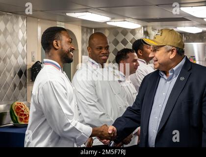 NORFOLK, Va. (Mar. 10, 2022) — Secretary of the Navy Carlos Del Toro greets culinary specialists assigned to the Ford-class aircraft carrier USS Gerald R. Ford (CVN 78) during a ship visit March 10, 2022. Secretary Del Toro is in Norfolk for the 100th celebration of Navy aircraft carriers and to conduct a roundtable with senior female leadership during Women’s History Month. Stock Photo