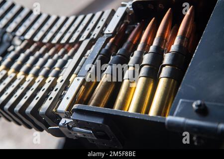 220310-N-EV253-1142 SAN DIEGO (March 10, 2021) – A GAU-21 .50-caliber machine gun is loaded and prepared for a weapons qualifications course on an MH-60S Knighthawk helicopter assigned to the “Merlins” of Helicopter Sea Combat Squadron (HSC) 3. HSC-3 is the Navy’s West Coast MH-60S fleet replacement squadron, responsible for training pilots and aircrewmen by providing the most capable warfighters to the fleet. Stock Photo