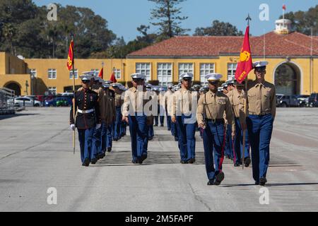 New U.S. Marines of Echo Company, 2nd Recruit Training Battalion, march in formation during a graduation ceremony at Marine Corps Recruit Depot San Diego, March 11, 2022. Graduation took place at the completion of the 13-week transformation including training for drill, marksmanship, basic combat skills and Marines Corps customs and traditions. Stock Photo