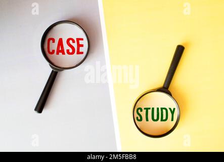 Hand showing CASE STUDY word through magnifying glass. Isolated white, financial and business concept Stock Photo