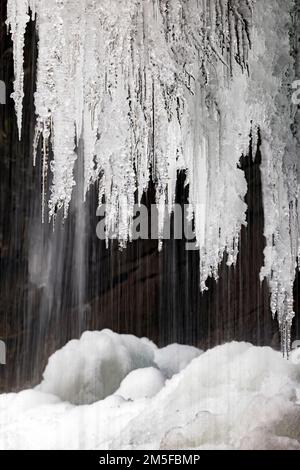 Icicles hanging from Slick Rock Falls in winter - Pisgah National Forest - near Brevard, North Carolina USA Stock Photo