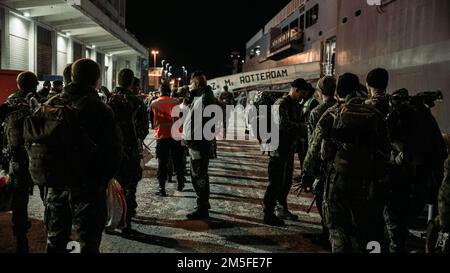 U.S. Marines prepare to embark on the HNLMS Rotterdam during Exercise Cold Response 2022, Trondheim, Norway, March 11, 2022. The Marines are assigned to 3rd Battalion, 6th Marine Regiment, 2d Marine Division, II Marine Expeditionary Force. Exercise Cold Response '22 is a biennial Norwegian national readiness and defense exercise that takes place across Norway, with participation from each of its military services, as well as from 26 additional North Atlantic Treaty Organization allied nations and regional partners. Stock Photo