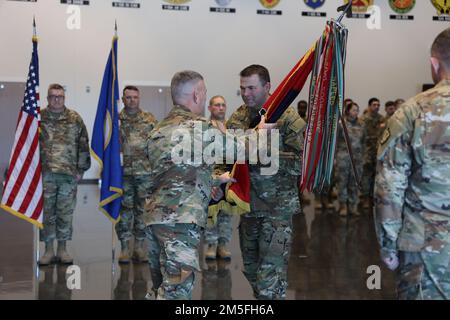 Incoming commanding general of the 34th Red Bull Infantry Division, Brig. Gen. Charles Kemper passes the division colors to Command Sgt. Maj. Stephen Whitehead. The passing of the colors represents a continuation of trust and signifies an allegiance of Soldiers to their new commander. A Change of Command ceremony for the 34th Red Bull Infantry Division took place, at their headquarters in Arden Hills, Minnesota on March 12, 2022. Outgoing commanding general, Maj. Gen. Michael Wickman, relinquished command to the incoming commander, Brig. Gen. Charles Kemper. (U.S. Army National Guard photos by Stock Photo