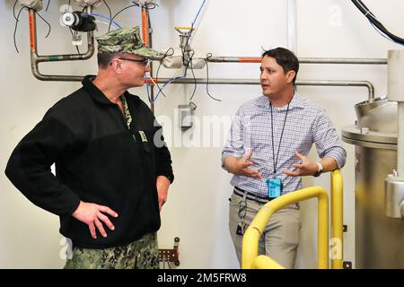 220314-N-CM812-032  Naval Surface Warfare Center Indian Head Division Agile Chemical Facility Commissioning and Startup Lead Engineer Scott Buswell discusses operational procedures and capabilities of the facility with Commander, Naval Sea Systems Command, Vice Adm. William Galinis during a tour of the command, Mar. 15. Stock Photo