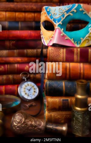 Old Mask On Stack Of Antique Books Stock Photo