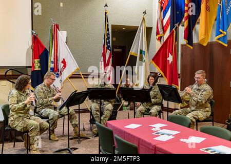 The 4th Infantry Division Band plays music during the Fort Carson and 4th Inf. Div. National Prayer Breakfast, March 15, 2022, at Fort Carson, Colorado. Maj. Gen. David Hodne, commanding general of the 4th Inf. Div. and Fort Carson, said that the purpose of National Prayer Breakfast is the power of prayer, faith, reflection of fellowship and unity. Stock Photo