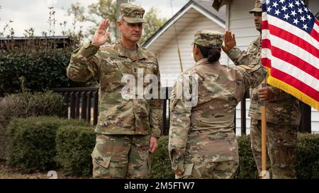 U.S. Army Maj. Gen. Charles Costanza, the 3rd Infantry Division commanding general, left, administers the Oath of Enlistment to Sgt. 1st Class Tania Sanchez, an East Hampton, New York, native and team leader assigned to the Noncommissioned Officer Academy, 3rd ID, at the NCO Academy on Fort Stewart, Georgia, March 15, 2022.  Sanchez reenlisted for the final time and will stay in the Army until she retires. Stock Photo