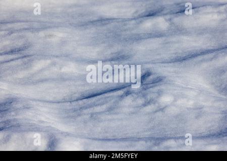 Fresh fallen snow dunes on sunny day Stock Photo