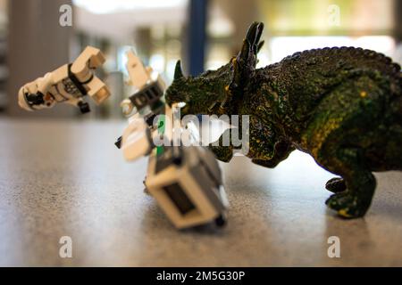 Toy Dinosaur Attacking Lego Star Wars Storm Trooper Stock Photo