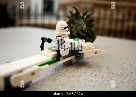 Toy Dinosaur Approaching Lego Star Wars Storm Trooper Stock Photo