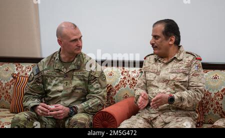 Maj. Gen. Wendul Hagler, the deputy commanding general of U.S. Army Central Command, talks with Brig. Gen. Fawaz Al-Harbi, Assistant Chief of Staff, Kuwaiti Army, before the start of the 7th Biannual Project Financial Management Review, held at the Kuwait Ministry of Defense, Kuwait City, on Mar. 16, 2022. Stock Photo