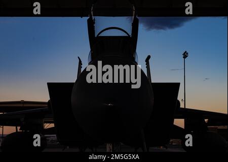 An F-15C Eagle assigned to the 53rd Wing at Eglin Air Force Base, Florida, has its canopy opened prior to pre-flight checks for its final flight at Nellis Air Force Base, Nevada, March 16, 2022. The Eagle's air superiority is achieved through a mixture of unprecedented maneuverability and acceleration, range, weapons and avionics. Stock Photo