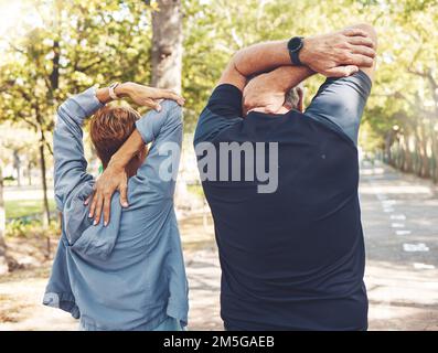 Back, couple and stretching outdoor exercise, fitness and training for wellness, health and bonding. Sports, man and woman in nature, workout and Stock Photo