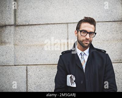 Looking sharp. Portrait of a confident young businessman in the city. Stock Photo