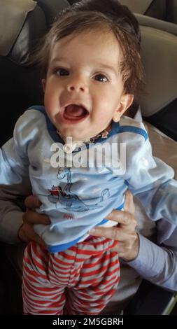 A child who had breathing problems was rescued by one of the co-pilots  in mahan air flight Stock Photo