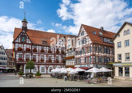 Half-timbered houses and inn on the market square of Bad Urach, Reutlingen district, Baden-Wuerttemberg, Germany Stock Photo