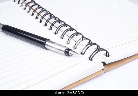 Parker pen on an open book Stock Photo