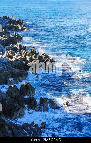 Sea waves break into the rocks Stock Photo