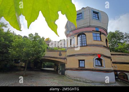 Hundertwasserhaus Waldspirale in backlight with foliage leaf, vine, in Darmstadt, Bergstrasse, Hesse, Germany Stock Photo