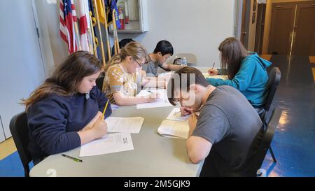 220317-N-LY580-1002 ALEXANDER CITY, Ala. (March 17, 2022) -- Benjamin Russell High School Navy Junior Reserve Officer Training Corps (NJROTC) Cadets (clockwise from bottom left) Bethany Mask, Katherine Taylor, Dylan Pham, Charlie Burgess and Austin Kenney compete in the 'War in the Pacific' academic postal sponsored by Clements High School NJROTC from Sugar Land, Texas. Stock Photo