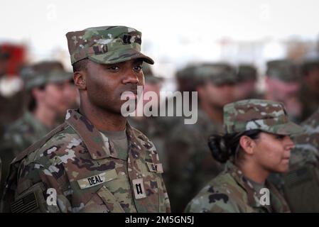 U.S. Illinois Army National Guard captain, 404th Maneuver Enhancement Brigade, waits to receive his combat patch, a military milestone earned while serving in hostile conditions, March 17, 2022. The 404th MEB Soldiers earned their patches while deployed to Combined Joint Task Force - Horn of Africa, located at Camp Lemonnier, Djibouti, the only permanent military base on the African continent. Stock Photo