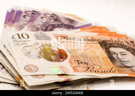 a few hundred pound of new GBP £ Sterling Twenty 20 and Ten 10 pound notes in a small fanned stack Stock Photo