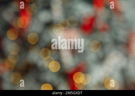 Christmas and New Year interior - background blur: green and red Christmas tree.. Lots of lights glowing .Bokeh. High quality photo Stock Photo